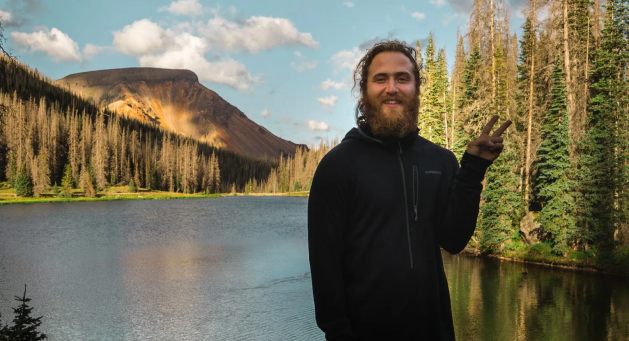 Mike Posner speaking on stage